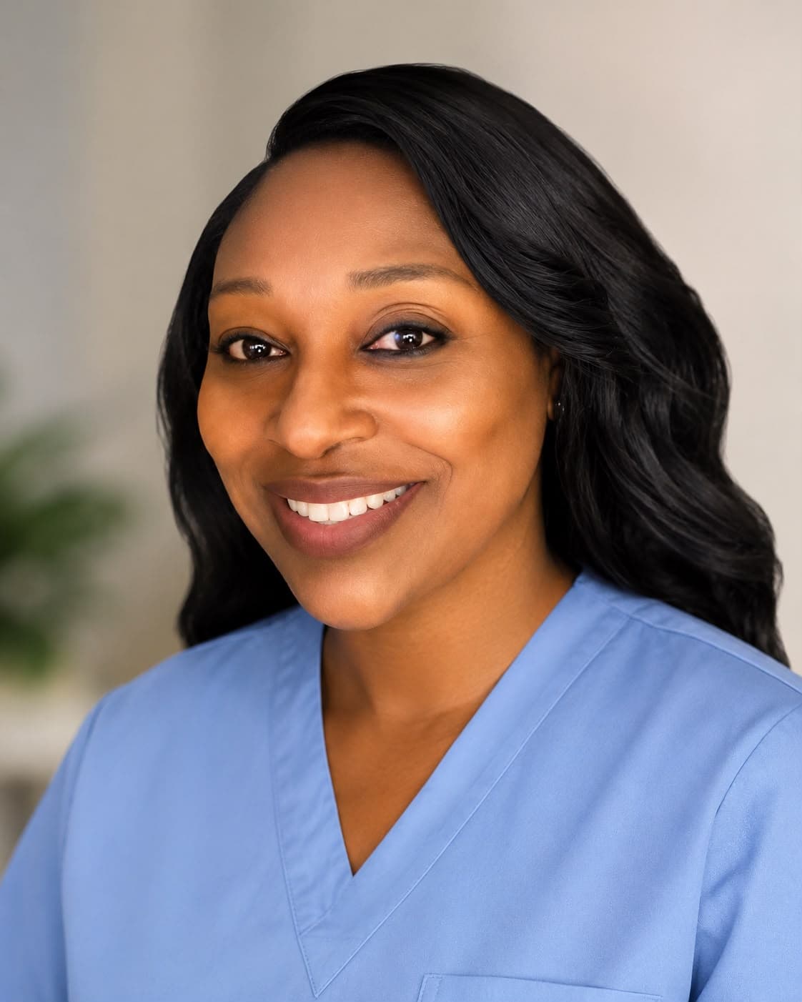 Tasha Johnson in blue scrubs